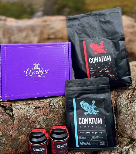 Conatum Coffee packages and a WeteBox box on a stone surface